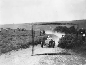 Racing Prints: T. L. Allard, driving a 4, 438 c. c. Allard sent the dust flying and he roars up to