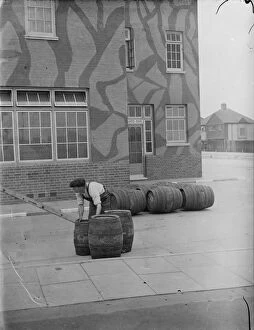 World War Two Ww2 Second World War Collection: Taking in a barrel delivery outside The Northover, a camouflaged public house in
