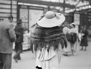 Taking her tails to Ascot. Photo shows: a fur cape with tails and a wide-brimmed