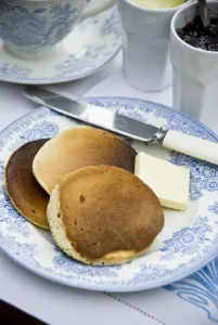 Teatime setting with scotch pancakes and raspberry jam credit: Marie-Louise Avery