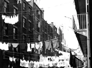 Living Conditions Prints: Tenements in St Pancras, London with laundry hanging from washing lines strung