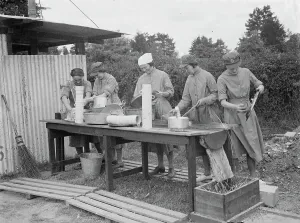 Territorial Army recruits at camp in Chichester, Sussex. The washing up. 1939