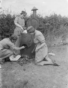 Territorial Army recruits at camp in Chichester, Sussex. Cleaning stove. 1939