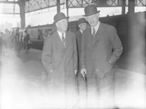 Thomas Lamont ( left ), famous American banker, arrives. A partner in the J P