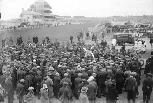 Tips for Derby week. A crowd gathers round a popular tipster. 4 June 1929