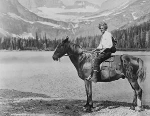 Tour of a great glacier. Hans Reiss, a famous alpine guide, guiding a tourist