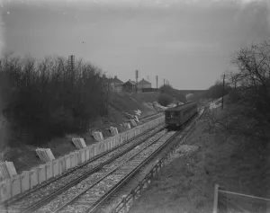 A train is going past the site where the Albany Park Train Station is under construction