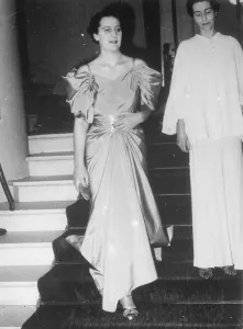 uncaptioned Well dressed woman walking down stairs