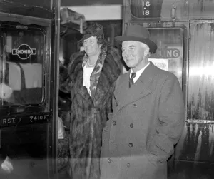 Fur Coat Prints: At Victoria. Sir John and Lady Simon. 23 December 1937 Simon, John Allsebrook