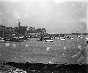 Harbour Collection: A view of Bridlington Harbour and town, Yorkshire. 11 January 1930 Fish where the fish are