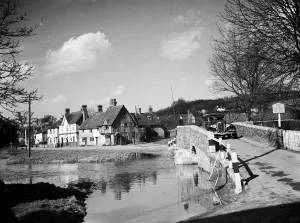 English Prints: A view of Eynsford with a car coming over the bridge by the ford over the River Darent