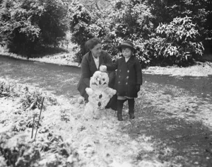 1910s Prints: Viscount Cranley, Lord Onslows son, makes effigy of the Kaiser in snow at Clandon Park