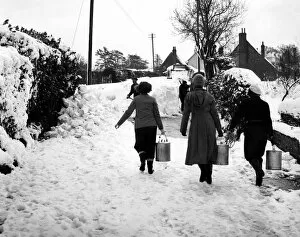 People Collection: Three volunteers taking milk to the Villager of Cudham, Kent, who were cut off by