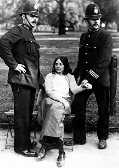 Suffragette Collection: Votes for Women - policeman with a suffragette arrested in Hyde Park about 1912