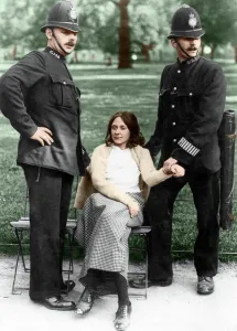 Sitting Prints: Votes for Women - policemen with a suffragette arrested in Hyde Park about 1912 Colourised