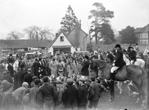 W. K. Hunt Crowds gather in the village of Offham, Kent for a foxhunt