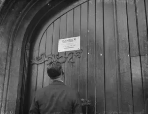 Church Prints: A warning sign on the door of a church building where an electric transformer station