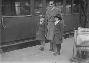 Father Prints: At Waterloo Herbert Sutcliffe with his wife and family on leaving for a Christmas cruise