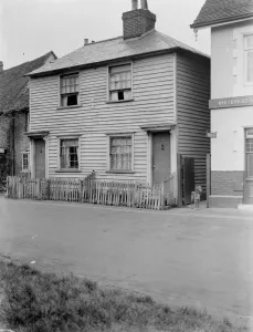 Fence Prints: Weather board cottage on the street in Eynsford, Kent. 1937