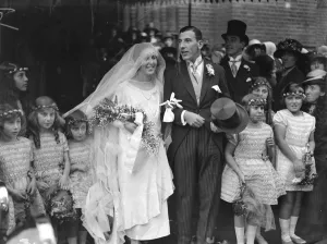 Wedding Dress Prints: Wedding of Mr G Hs Edgar and Miss E V Samuel, at the west end Synagogue The bride