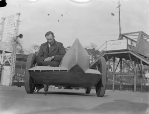Vehicle Prints: Weird car for Easter Monday racing at Brooklands. Mr H G Dobbs with his Riley
