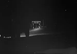 Sign Prints: Westerham road sign, as seen at night. 1936