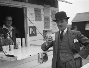 Whitbreads hop farm in Belting, Kent. A gentleman enjoys a cup of milk
