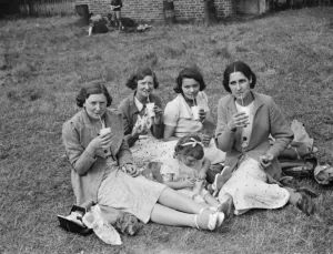Whitbreads hop farm in Belting, Kent. Some ladys are enjoying a cup of milk