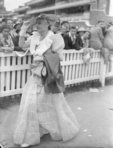 In white as Ascot. Photo shows: Picture hat, puff sleeves and flared skirt - an