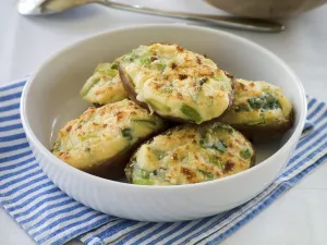 Cooking Prints: White dish of baked potato halves topped with melted cheese mixture and finished under a hot grill