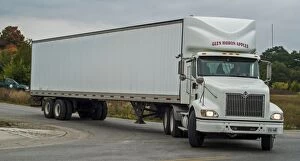 Food Collection: White International 6x4 semi tracter with a white twin axle box trailer turns right