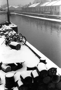 Water Prints: Winter in London (?) terraced housing in the snow, on the canal. No further details