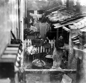 Fence Prints: Two woman living in Shoreditch slums, 1922. Surviving and bringing up a family in
