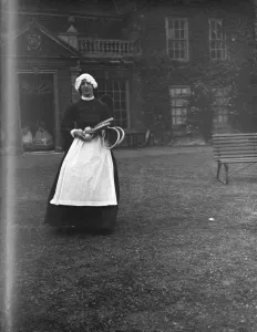 Apron Prints: A woman in a servants period dress at Lullingstone Park near Eynsford, Kent