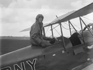 Flying Helmet Prints: More women learning to fly. London pupils who show skill and coolness. Mrs Simon