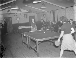 Women playing in a table tennis tournament at a venue on Burnt Oak Lane in Sidcup, Kent