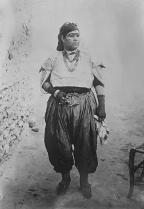 Where women wear the breeches. A quaint picture from the city of Tunis, showing