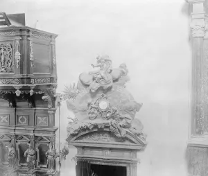 A wonderful clock in the Cathedral, Warsaw. The carving round the clock represents