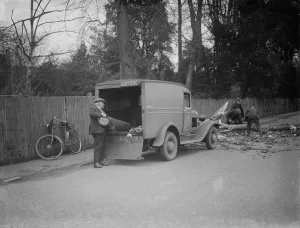 Workers clear a tree blown down by the gales in Crayford. 1938