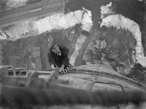 A workman climbs up on of the chimneys of the new coal electric power station under