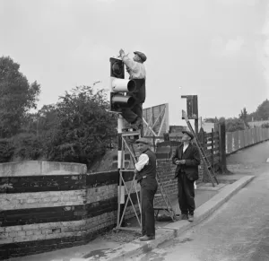 Workmen work on traffic lights in Swanley. 1936