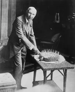 Worlds richest man, John D Rockefeller cutting his birthday cake. 18 July 1929