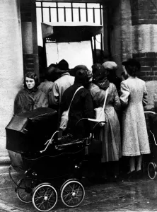 WW2: Anxious relatives read the list of survivors of HMS Royal Oak. Sept. 1939
