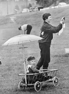 Umbrella Prints: One year old Kent Nystrom is happy just sitting in the little truck watching mummy