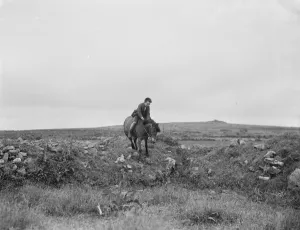 A young boy rides a horse bareback. 1936