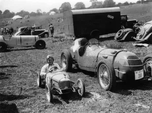 Youth Prints: A young boy in his small motorcar