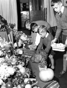 Religious Prints: Young children bring their gifts to the Harvest Festival Service - held at Foster s