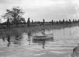 A young girl in a rowing boat on Scadbury Lake. 1939