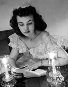 Romance Prints: Young woman reading a letter by candlelight from her sweetheart in the American Forces in England