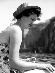Fifties Prints: A young woman in a strapless dress enjoys the summer sunshine